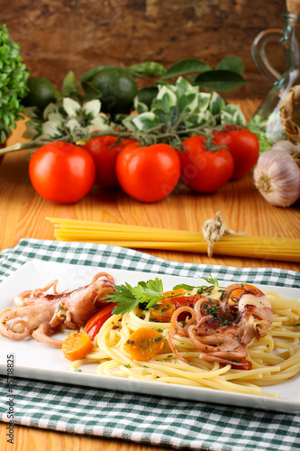 Pasta with octopus, tomatoes and carrots