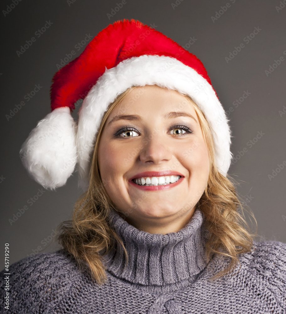 Beautiful smiling young Santa hat in studio Beautiful smiling young Santa hat in studio