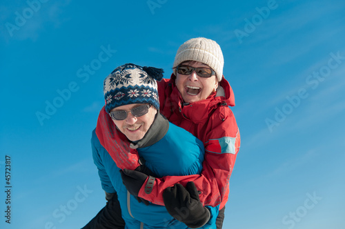Winter fun - happy senior couple