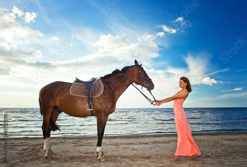 girl with horse on seacoast © Igor Normann