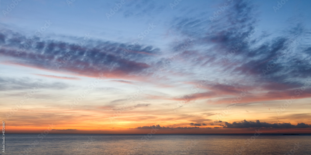 Fine orange and blue sunrise on the beach