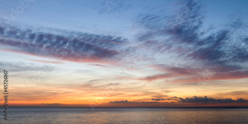 Fine orange and blue sunrise on the beach