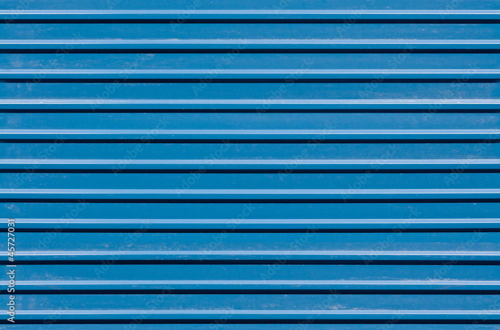 Horizontal ridged blue painted metal wall texture