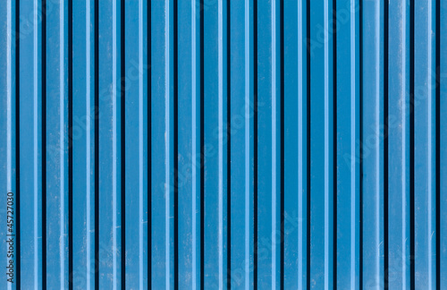 Vertical ridged blue painted metal wall texture