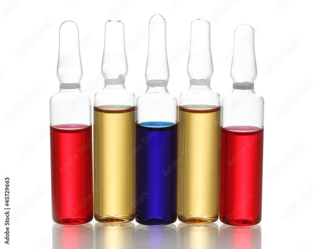 medical ampules with bright liquid, isolated on white medical ampules with bright liquid, isolated on white