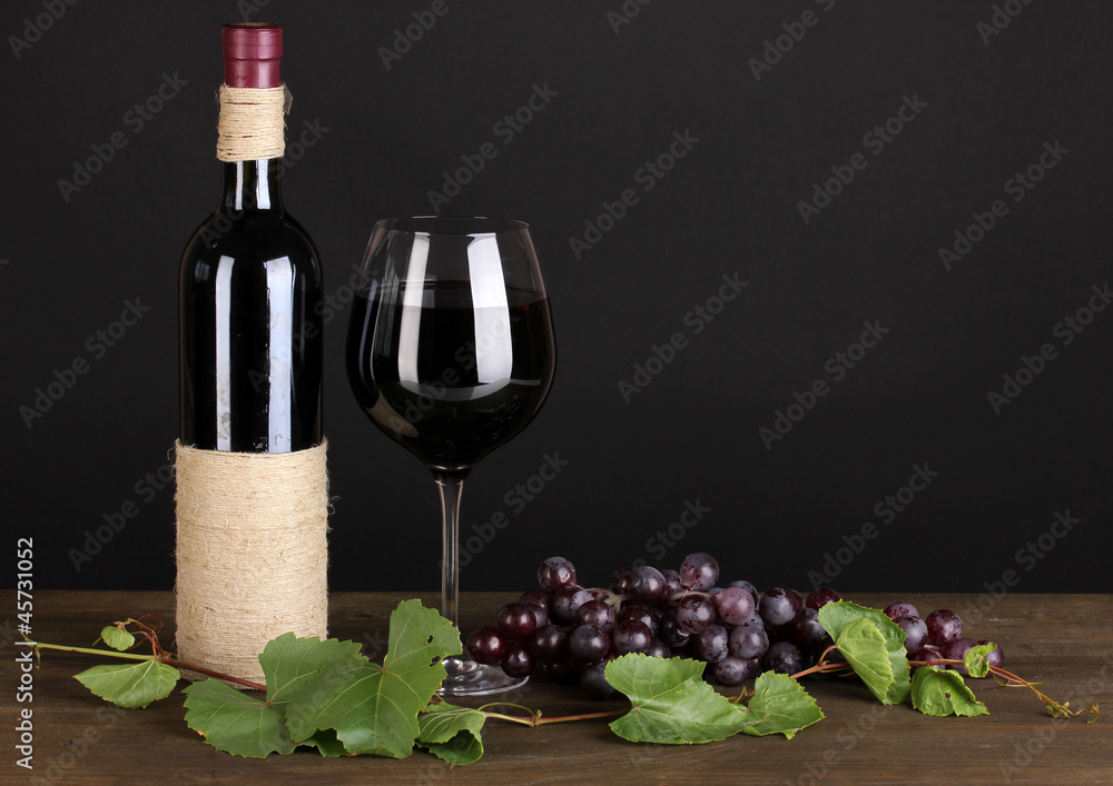 bottle of wine with grape leaves
