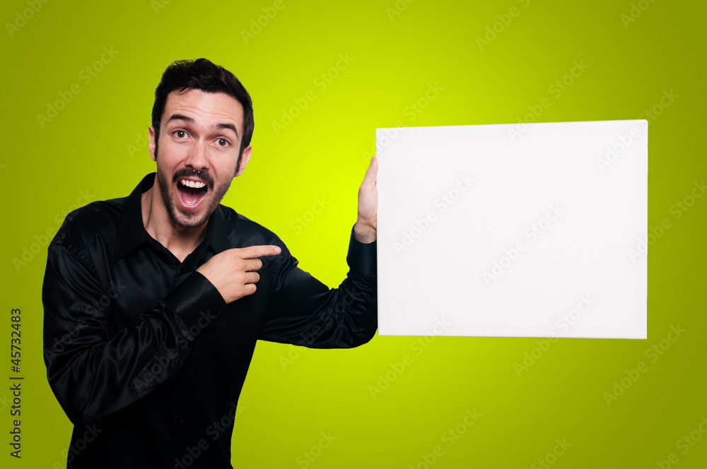 man holding blank white board on yellow backgroud man holding blank white board on yellow backgroud