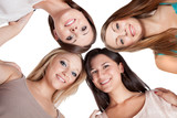 Four young woman looking down
