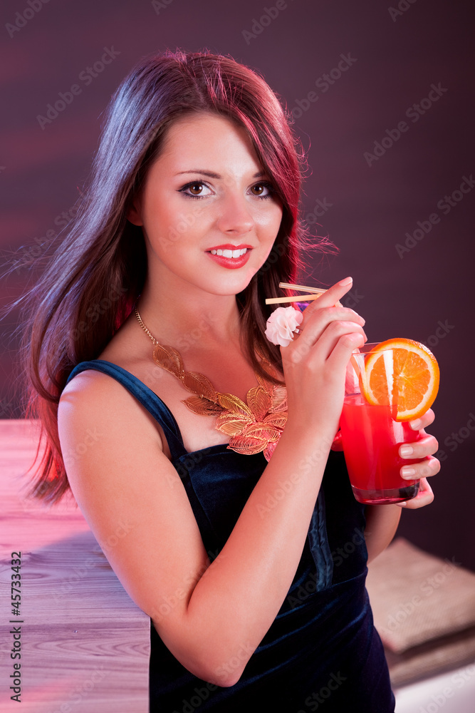 Glamorous woman holding a cocktail Glamorous woman holding a cocktail