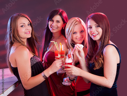 Happy female friends celebrating