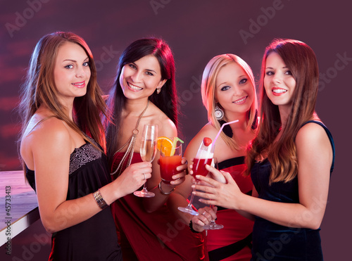 Happy female friends celebrating