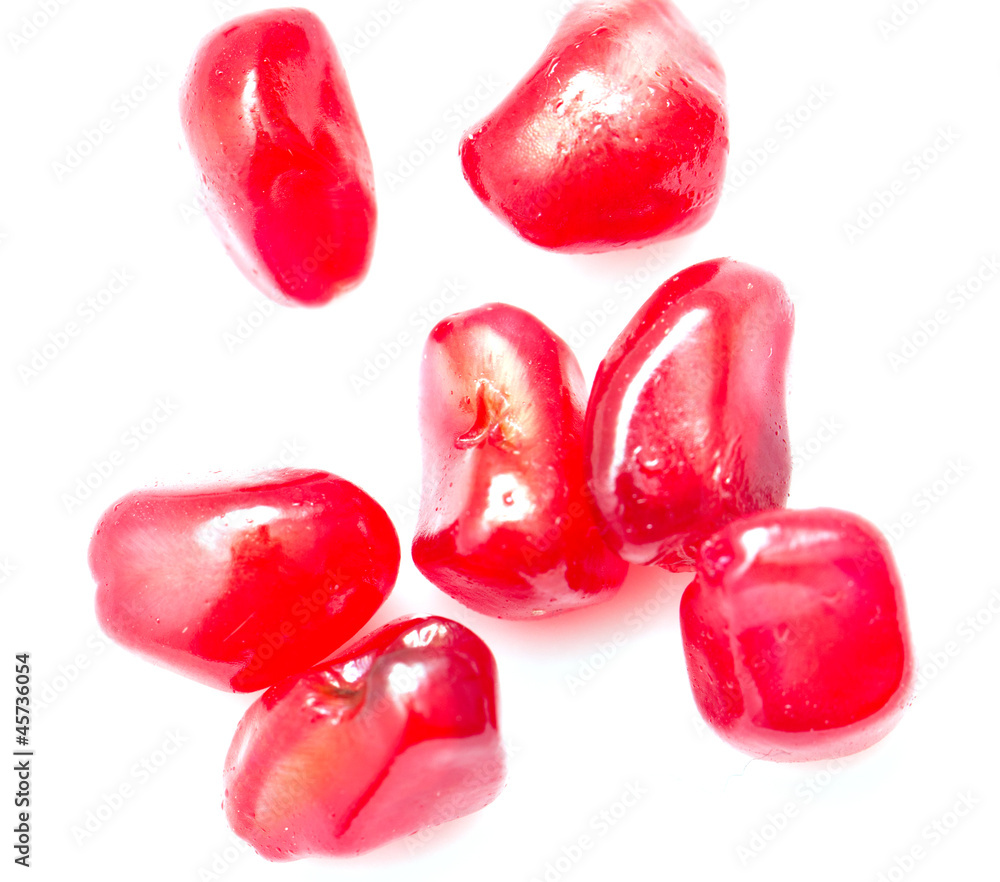 pomegranate on a white background. macro pomegranate on a white background. macro