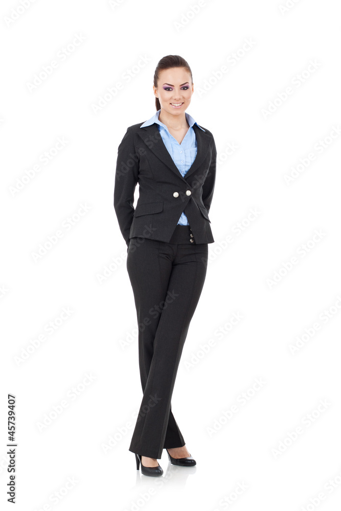 woman stands with crossed legs