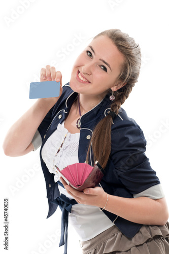 The girl gets a credit card from a purse