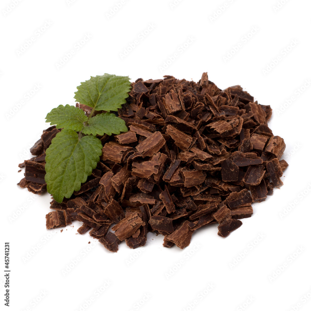 Crushed chocolate shavings pile and mint leaf