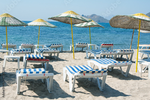 Loungers and umbrellas on beach