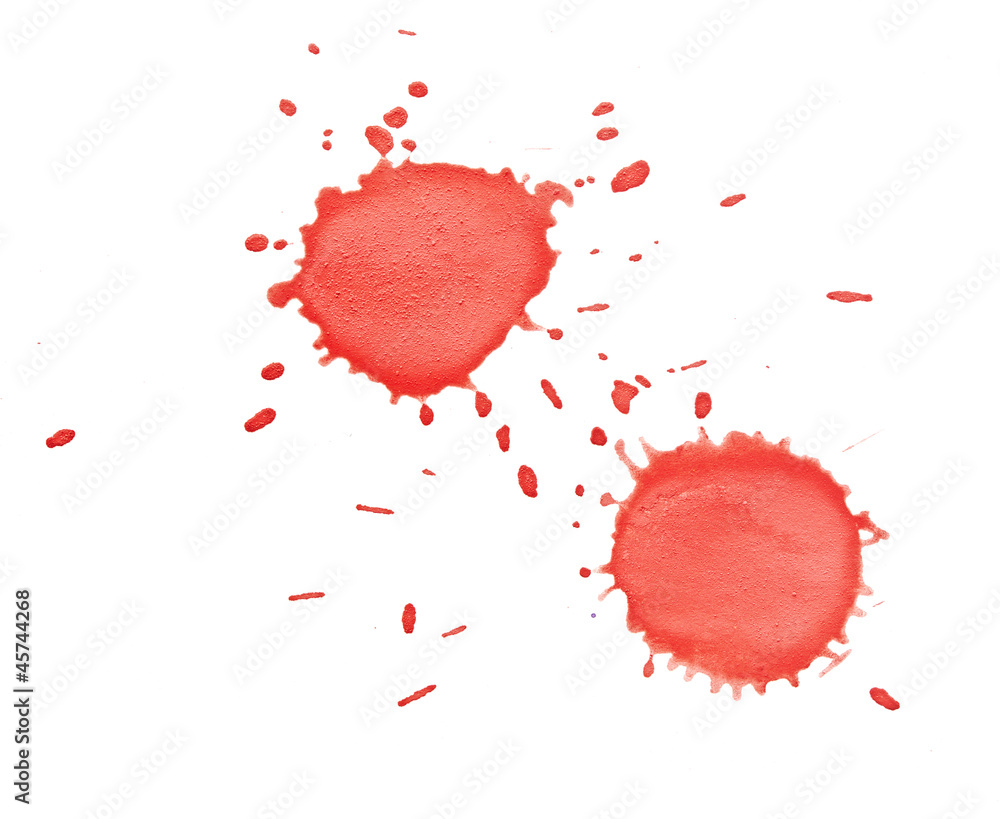 red spot with splashes on white surface red spot with splashes on white surface