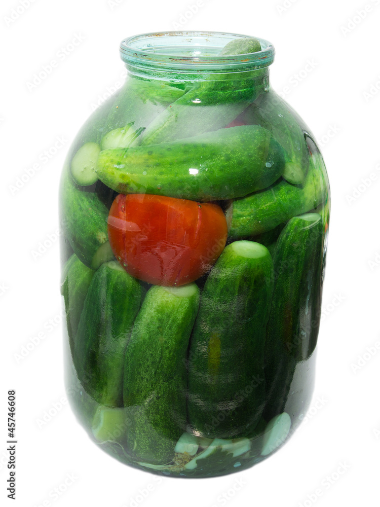 salted cucumber and tomatoes in a jar on a white background salted cucumber and tomatoes in a jar on a white background