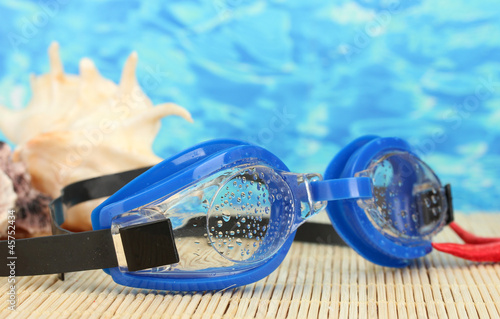 blue swim goggles with drops