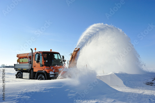 snow blow cleaning road