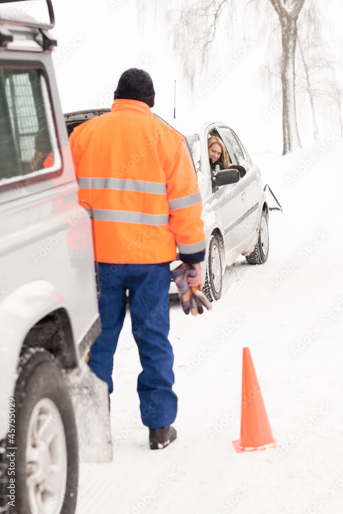 Man helping woman car breakdown assistance snow Man helping woman car breakdown assistance snow