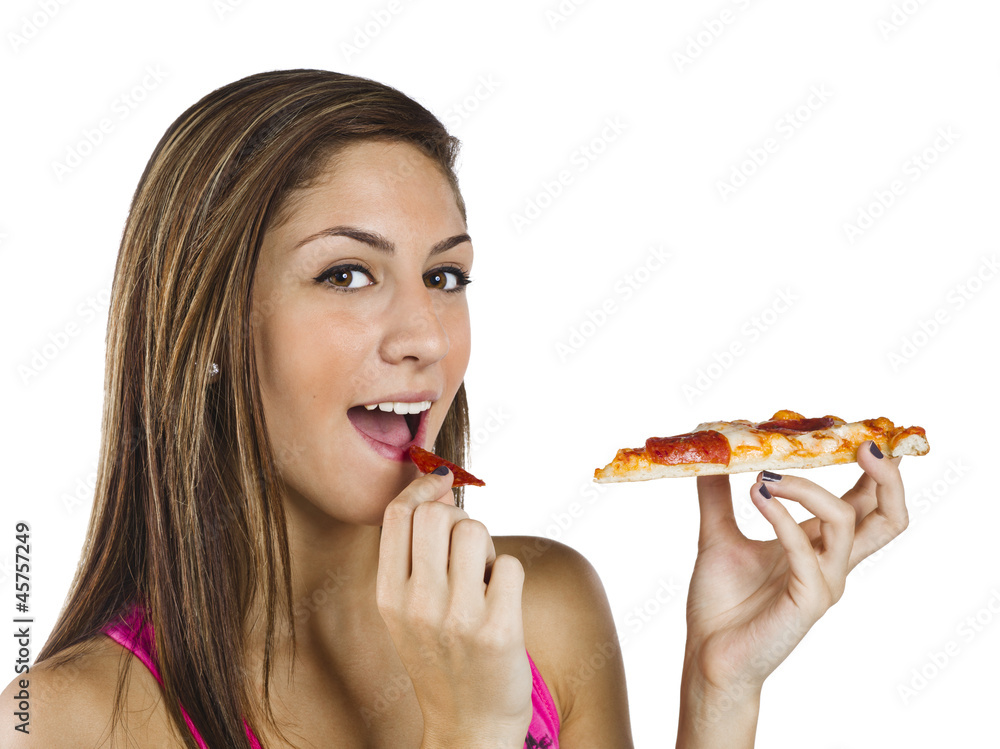 portrait of a beautiful teenage girl eating pizza