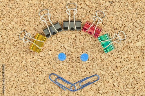 happy face made of colorful clips