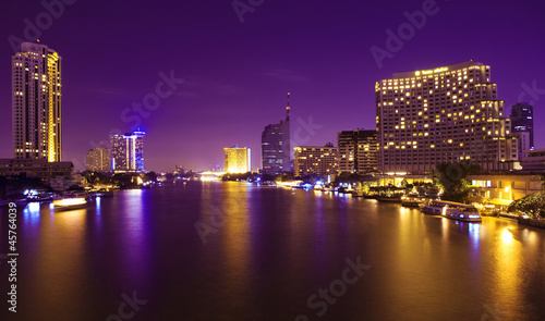 City and the river in the night time. © samarttiw