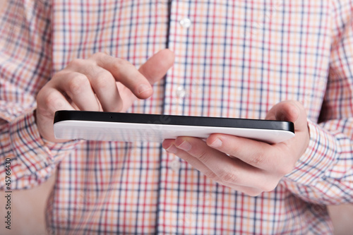 Young man touching tablet pc