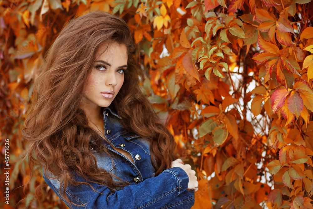 Beautiful elegant woman in a park, autumn portrait Beautiful elegant woman in a park, autumn portrait