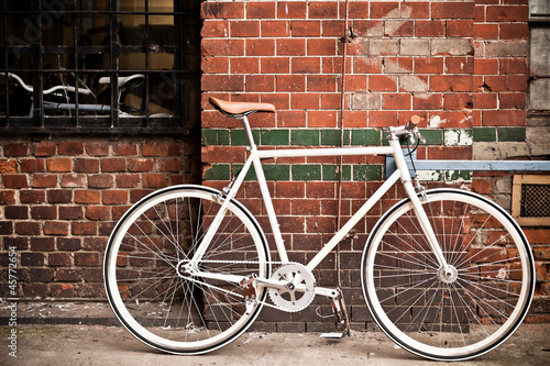 City bicycle on red wall, vintage style