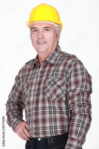 Portrait of man with yellow helmet
