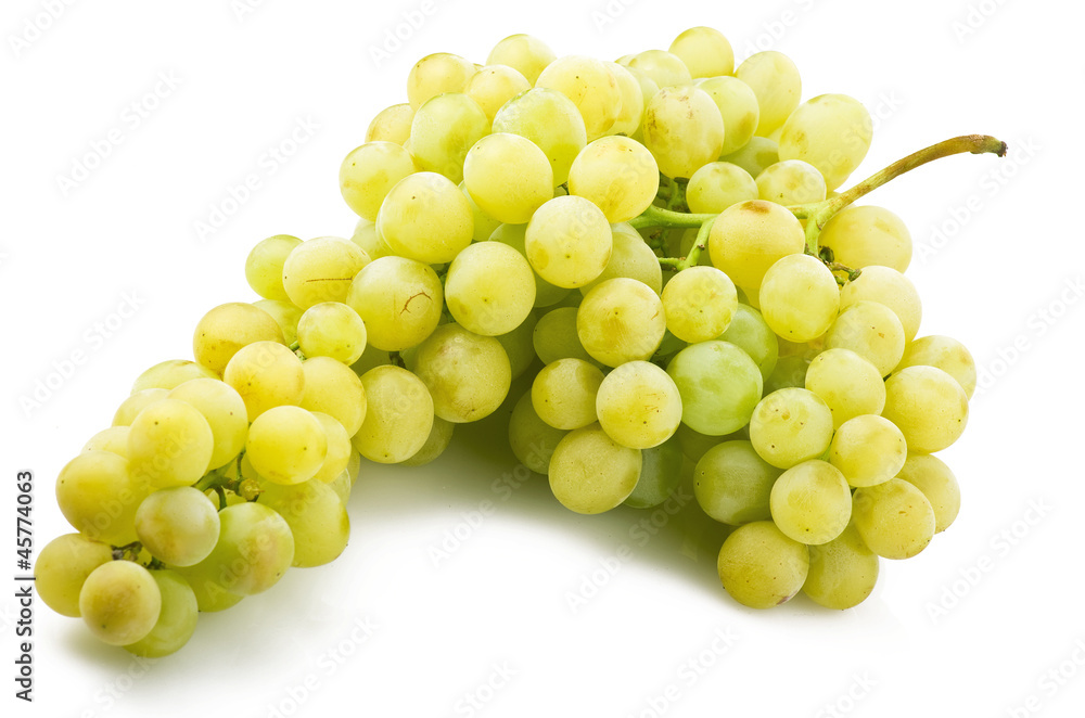 Fresh green grapes close up on the white Fresh green grapes close up on the white