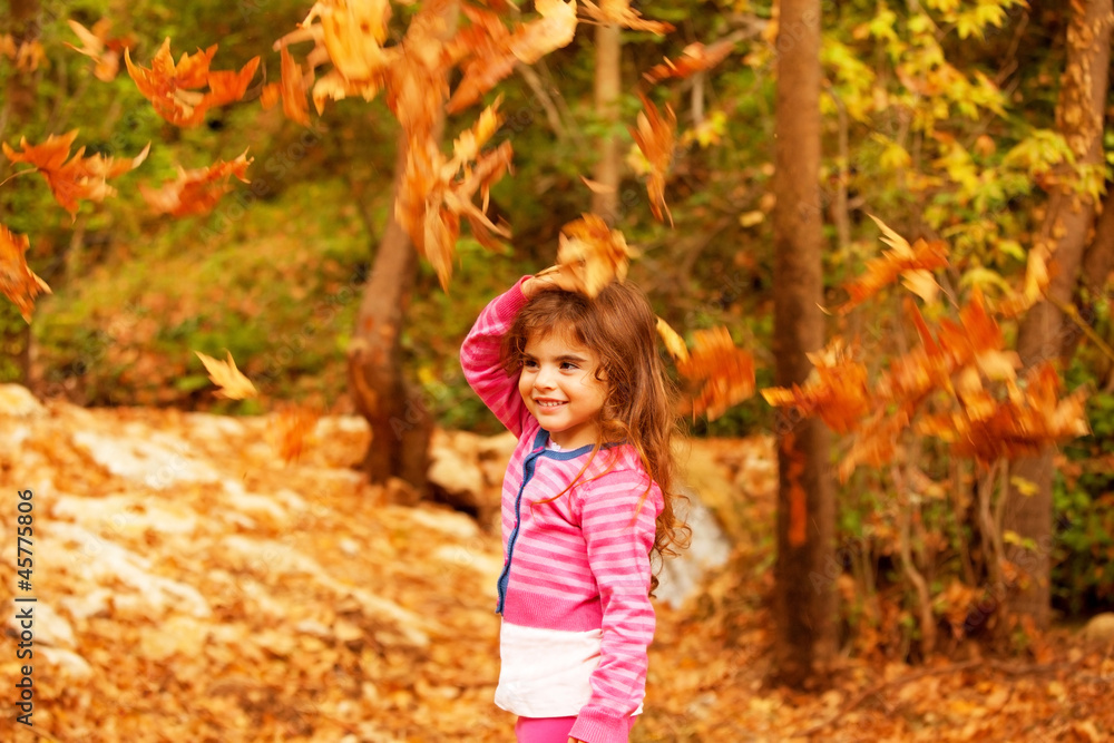 Sweet little girl in autumn forest Sweet little girl in autumn forest