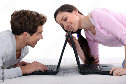 Vászonkép Couple with laptops