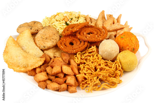 Traditional indian snack platter isolated on white.