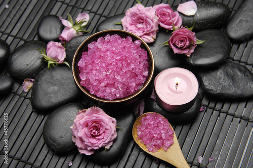 pink rose with salt in bowl and candle on mat