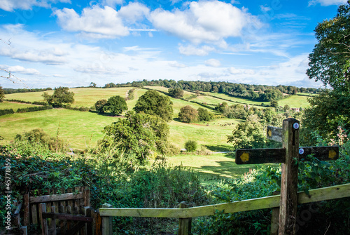 View past footpath sign towards rolling hills Petworth UK