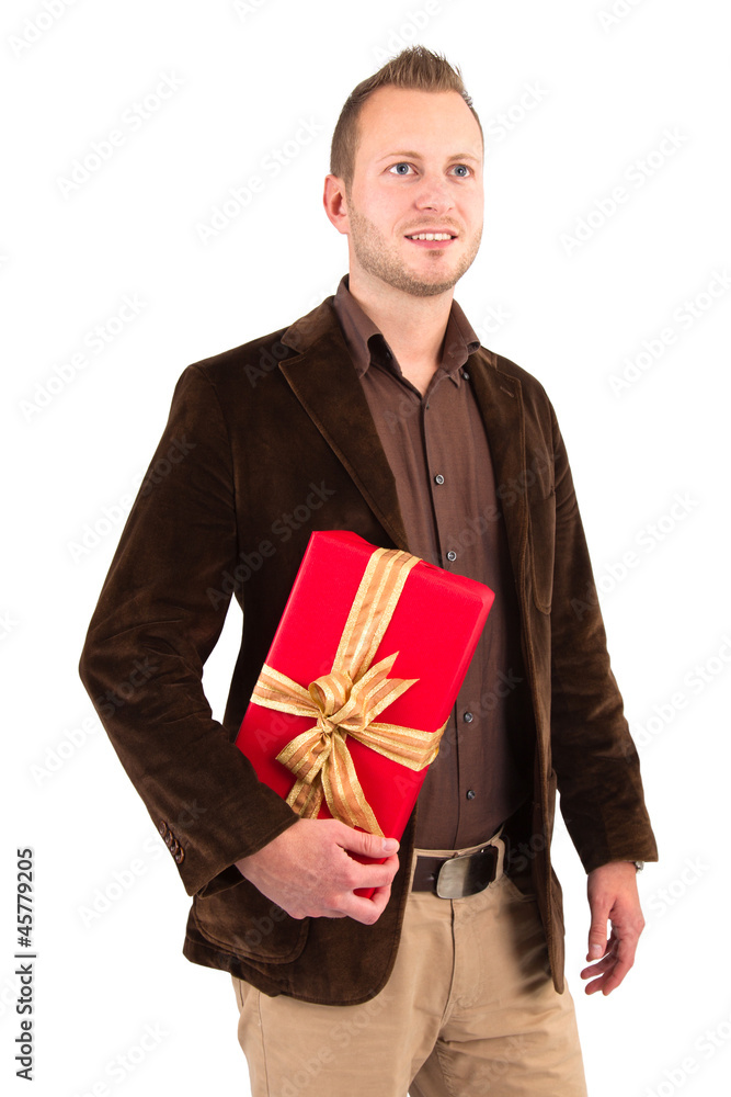 Attraktiver Mann mit einem roten Weihnachtsgeschenk Attraktiver Mann mit einem roten Weihnachtsgeschenk
