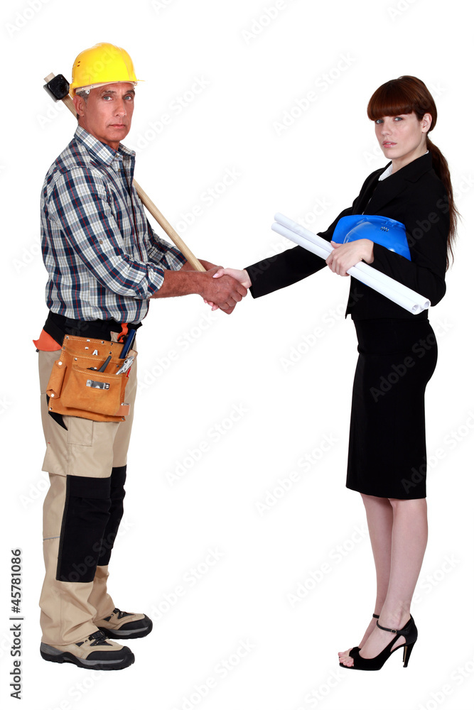 construction workers handshaking construction workers handshaking