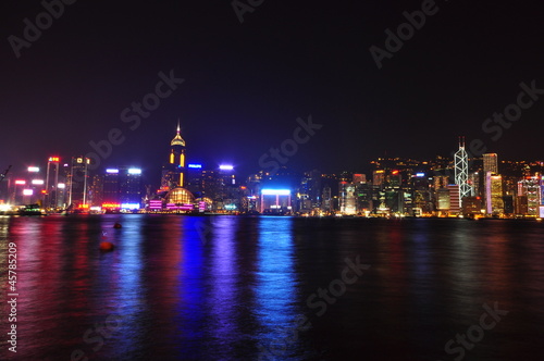 Hong Kong city skyline at night over Victoria Harbor © stationidea