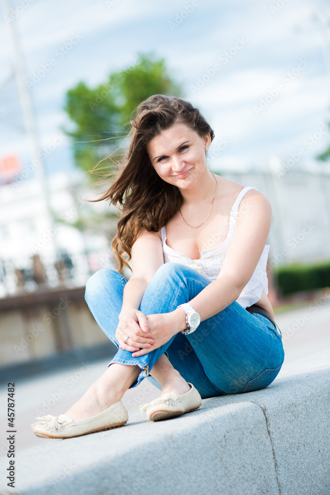 Fototapeta premium Portrait of a beautiful european woman smiling outdoors