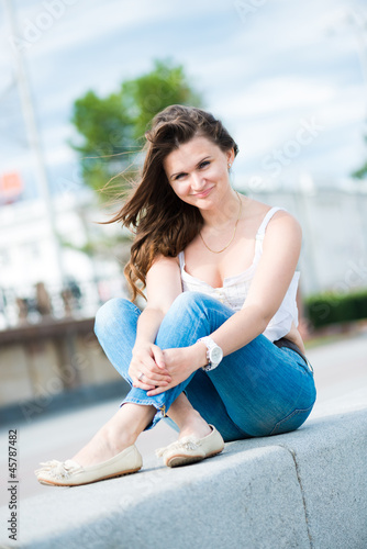 Portrait of a beautiful european woman smiling outdoors