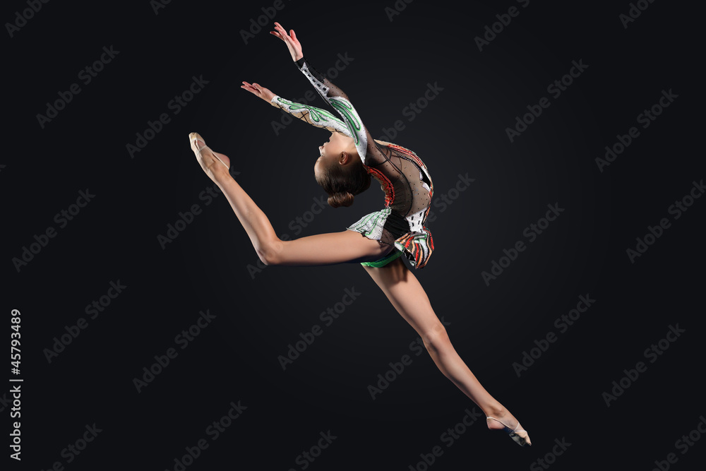 Young woman in gymnast suit posing Young woman in gymnast suit posing