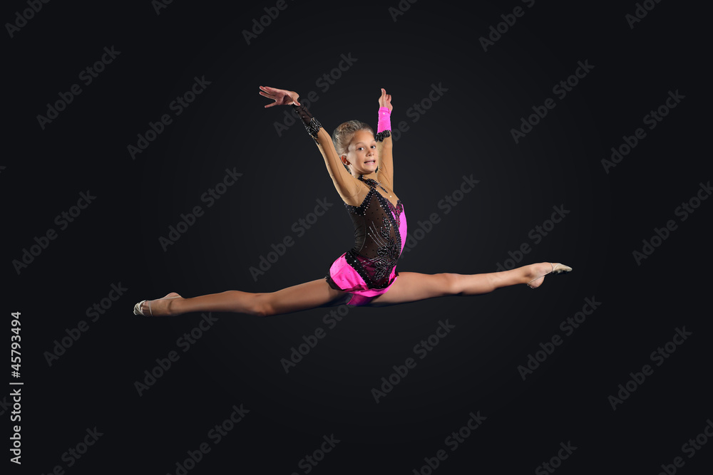 Naklejka premium Young woman in gymnast suit posing