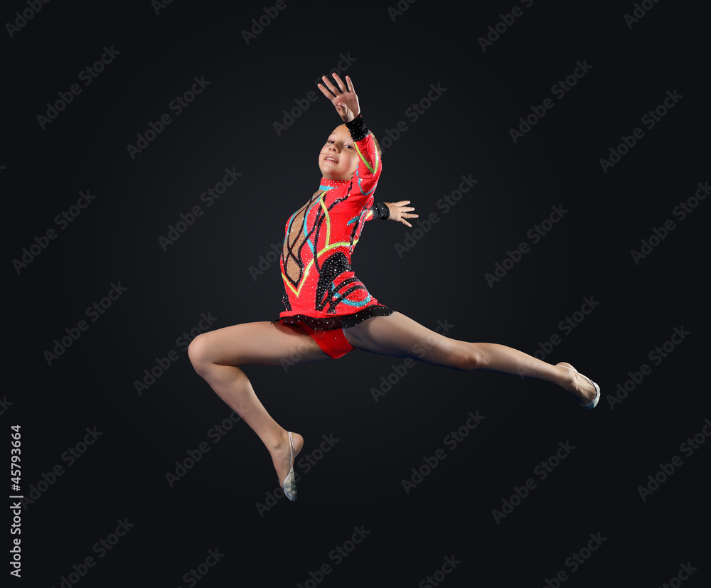 Young woman in gymnast suit posing