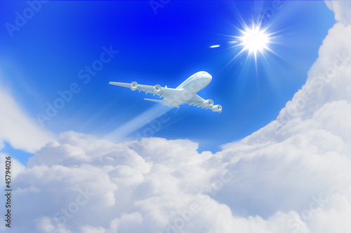 White passenger plane in the blue sky