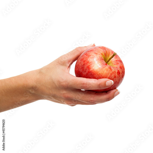 Female hand holding red apple.