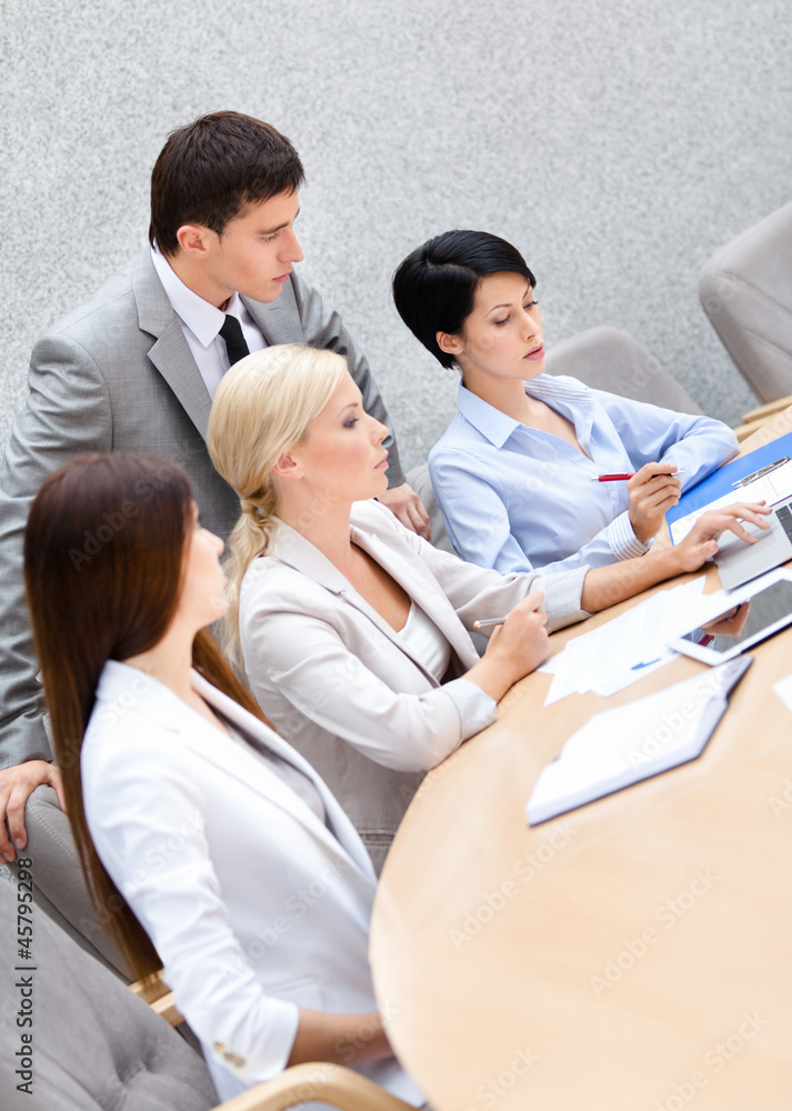 Business people at the seminar discuss current issues Business people at the seminar discuss current issues