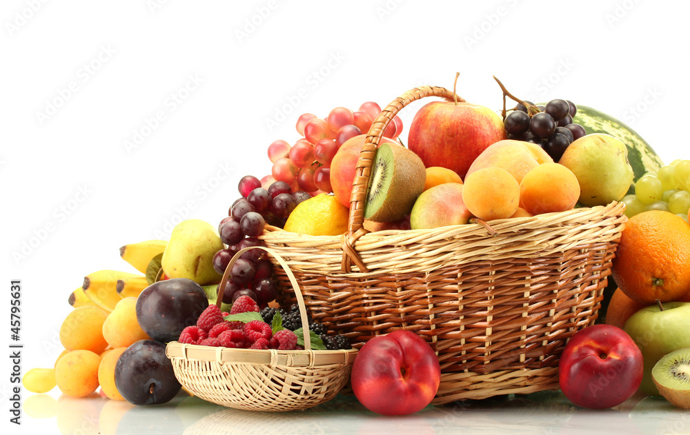 Assortment of exotic fruits and berries in baskets isolated Assortment of exotic fruits and berries in baskets isolated